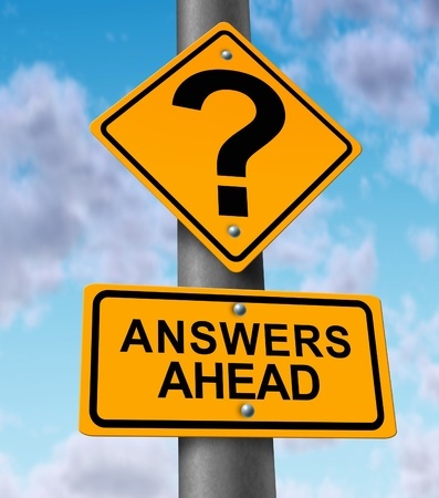 Two yellow road signs: one with a question mark, one saying Answers Ahead, against a blue sky with clouds.