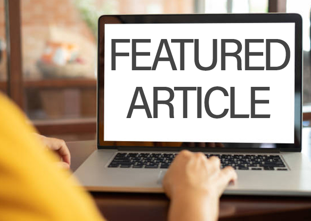 Person using a laptop with the words FEATURED ARTICLE displayed on the screen.
