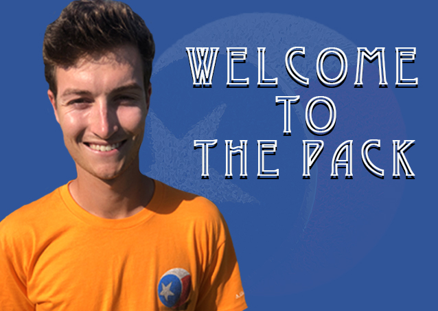 Smiling person in an orange shirt with Welcome to the Pack text on a blue background.